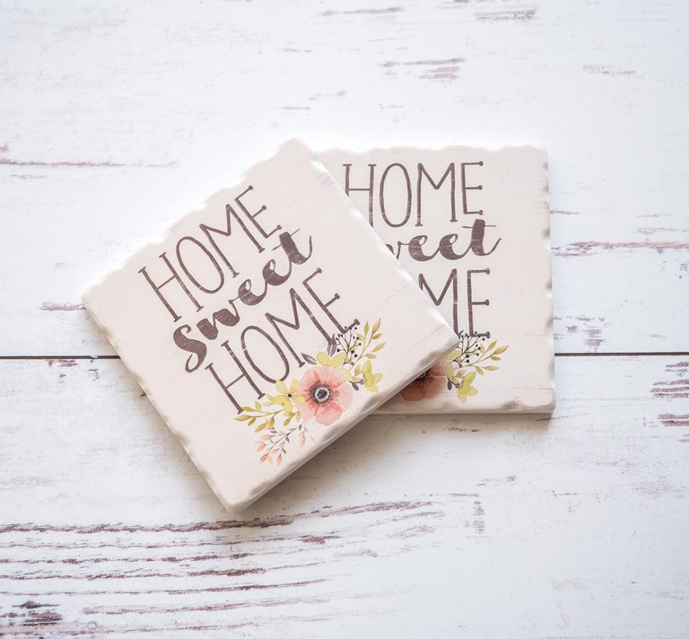 Pair of CounterArt and Highland Home GHome Sweet Home coasters on white backdrop