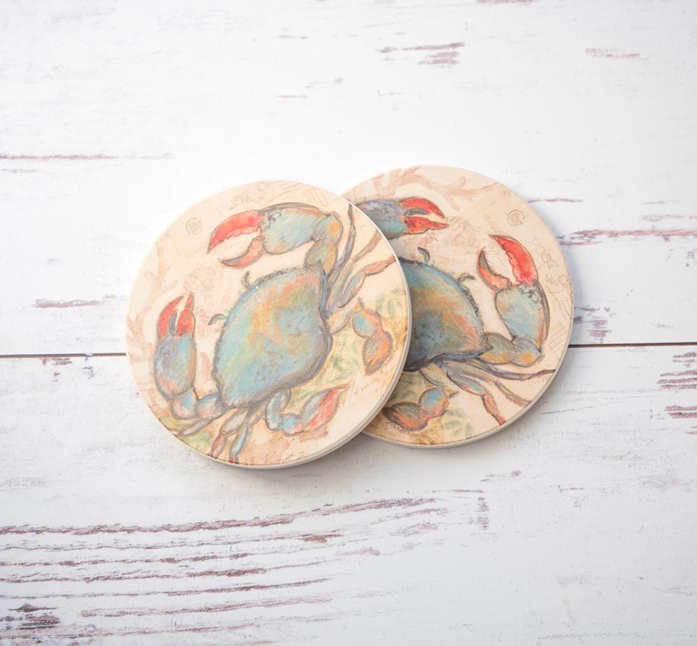 Seaside Blue Crab coaster pair by CounterArt and Highland Home on a rustic white wood background