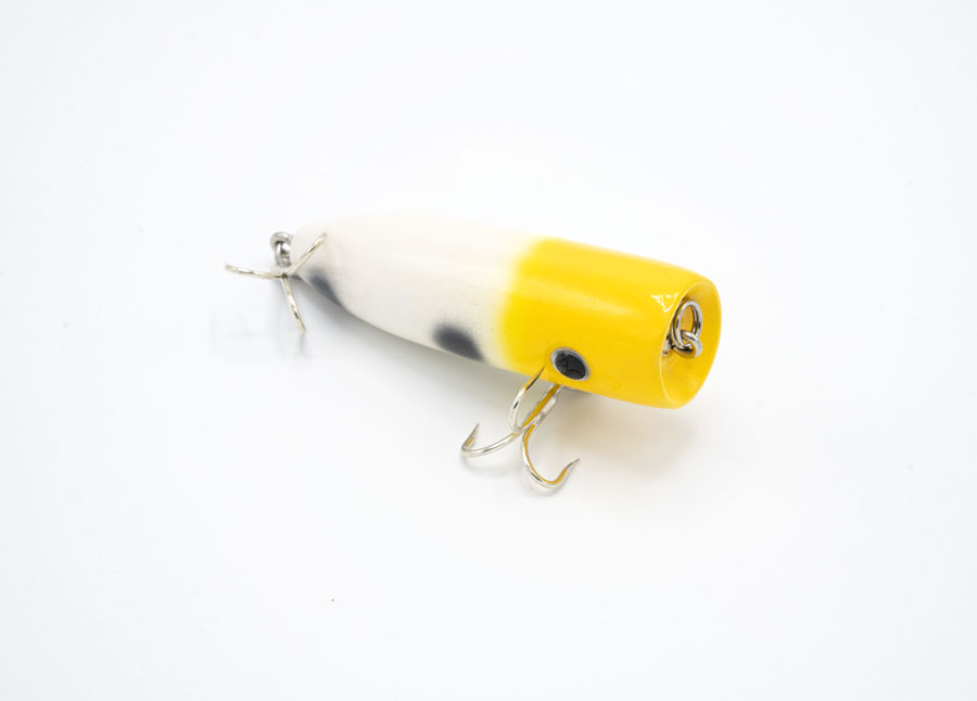 Upright view of the Yellow, white and black speckled pine wood fishing lure by JL Lures