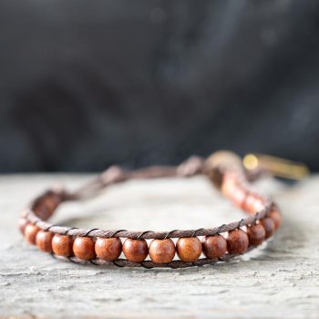 Front view of the Surf Rider Dawn Patrol men's bracelet on a rustic wooden backdrop