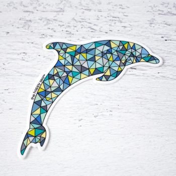 Colorful dolphin sticker by The Happy Sea on distressed white wood
