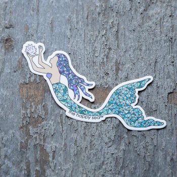 Colorful mermaid sticker by The Happy Sea on a rustic piece of wood