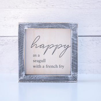 Gia Roma Happy as a Seagull with a French fry wooden home accent against white wooden background