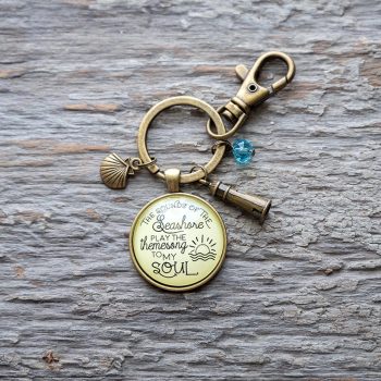 Sounds of the seashore keychain by Gutsy Goodness on a rustic piece of wood