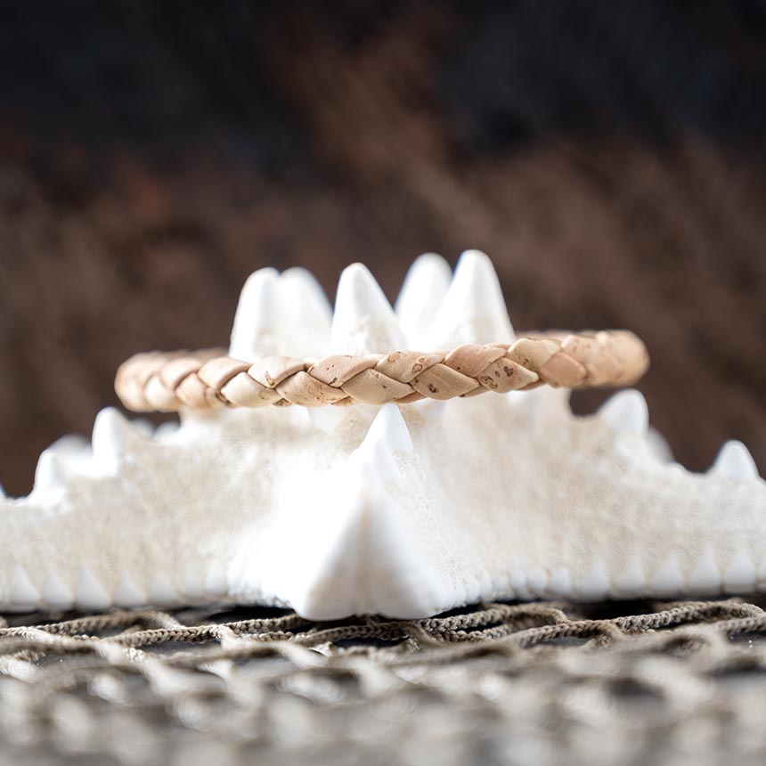 Back view of the men's Cork Tree Designs Corked weaved natural bracelet on a starfish