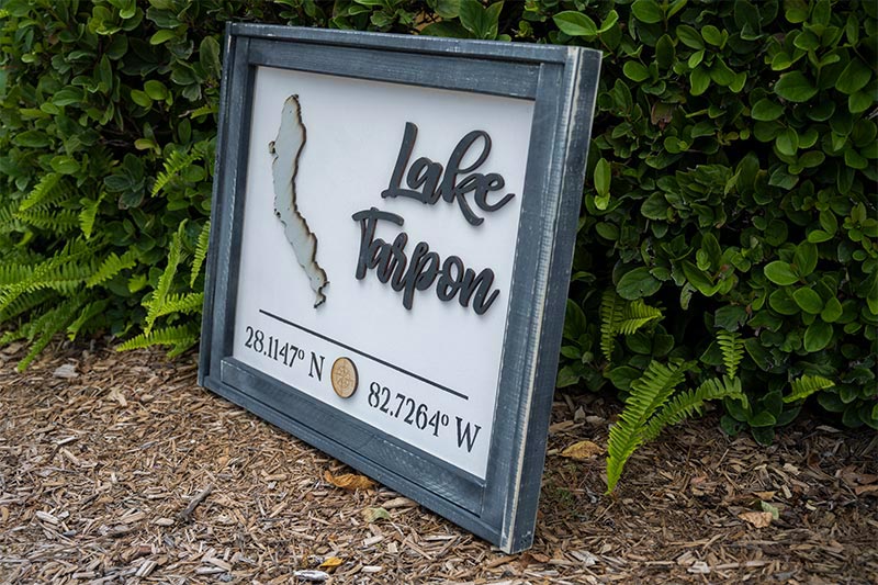 Angled View of the Handmade Wooden Lake Tarpon Coordinates Sign by Pine Designs