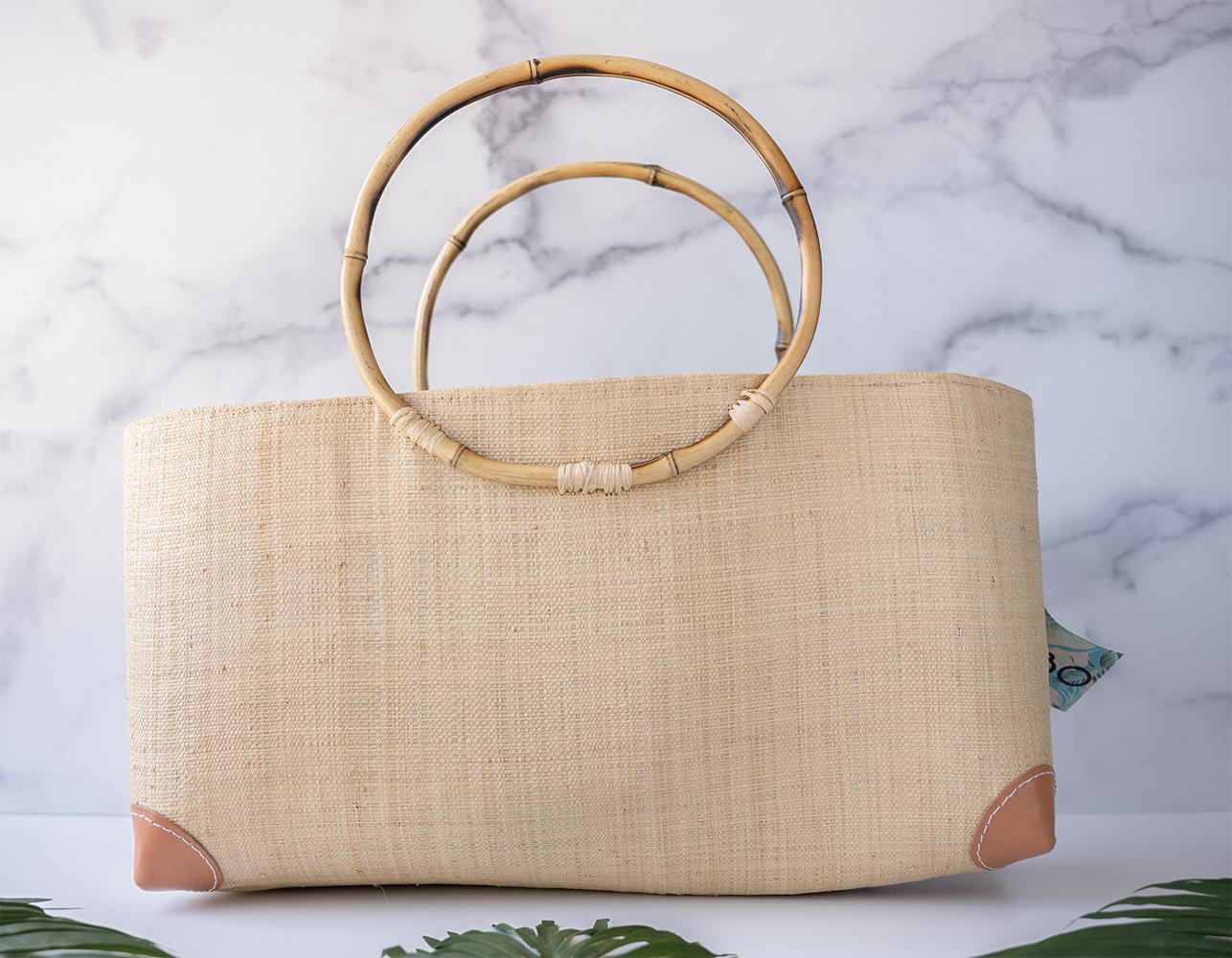 Side View of the Shebobo Bebe Straw Bag with Bamboo Handles