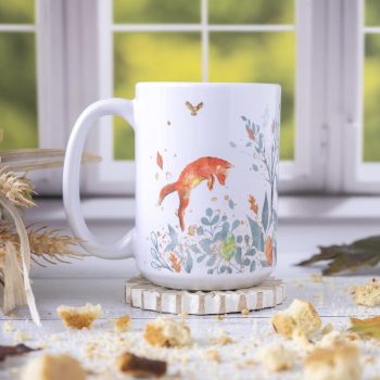 Right view of the Florae & Snow Nordic Woodland mug against a Fall window backdrop with biscotti