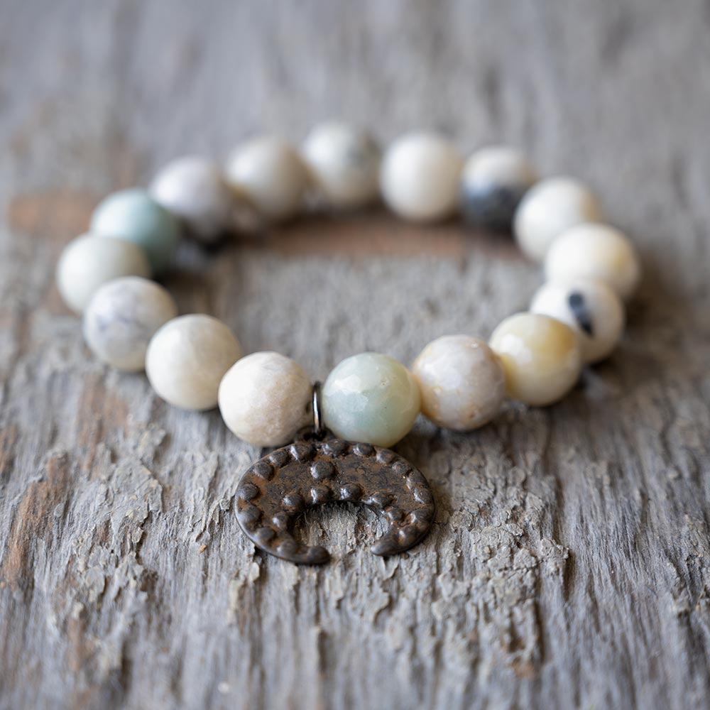 Closeup Front view of the VB&CO Beaded Amazonite Bracelet with Moon Charm on Rustic Wood