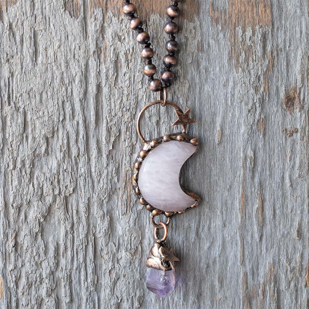 Front view of the VB&CO Designs Luna Moon Boho Necklace Against a Rustic Wood Backfrop