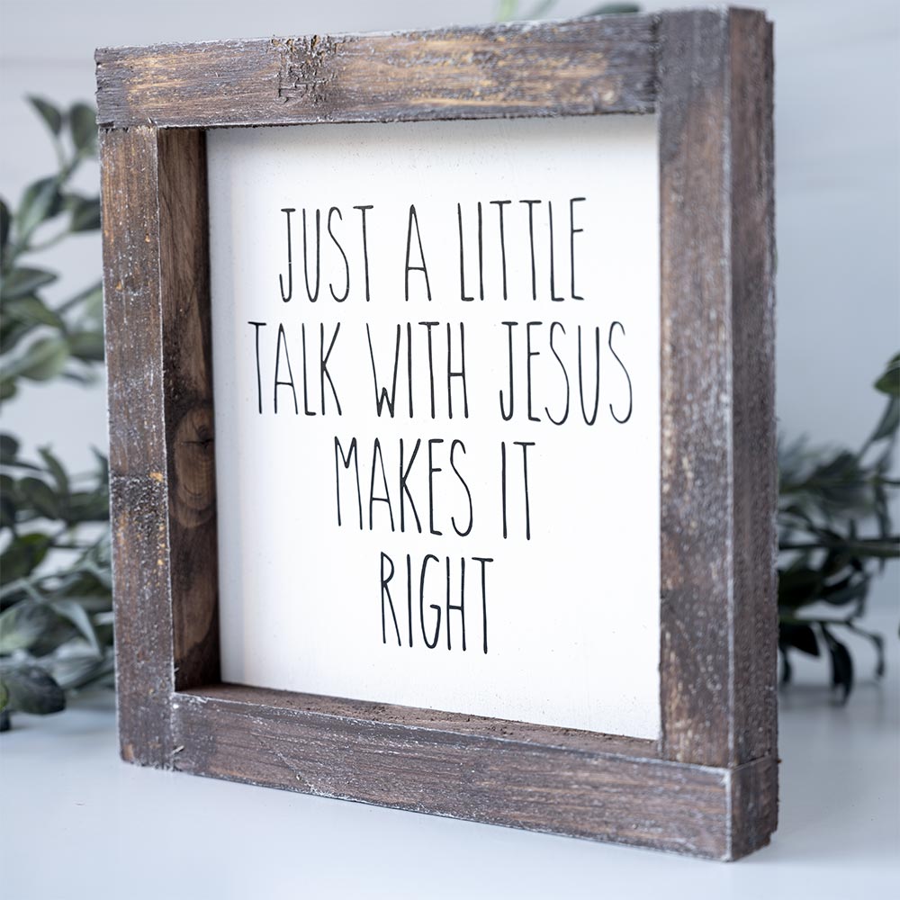 Angled View of the Joshua Jar Just a Little Talk with Jesus Makes it Right wood sign against a white backdrop and greenery