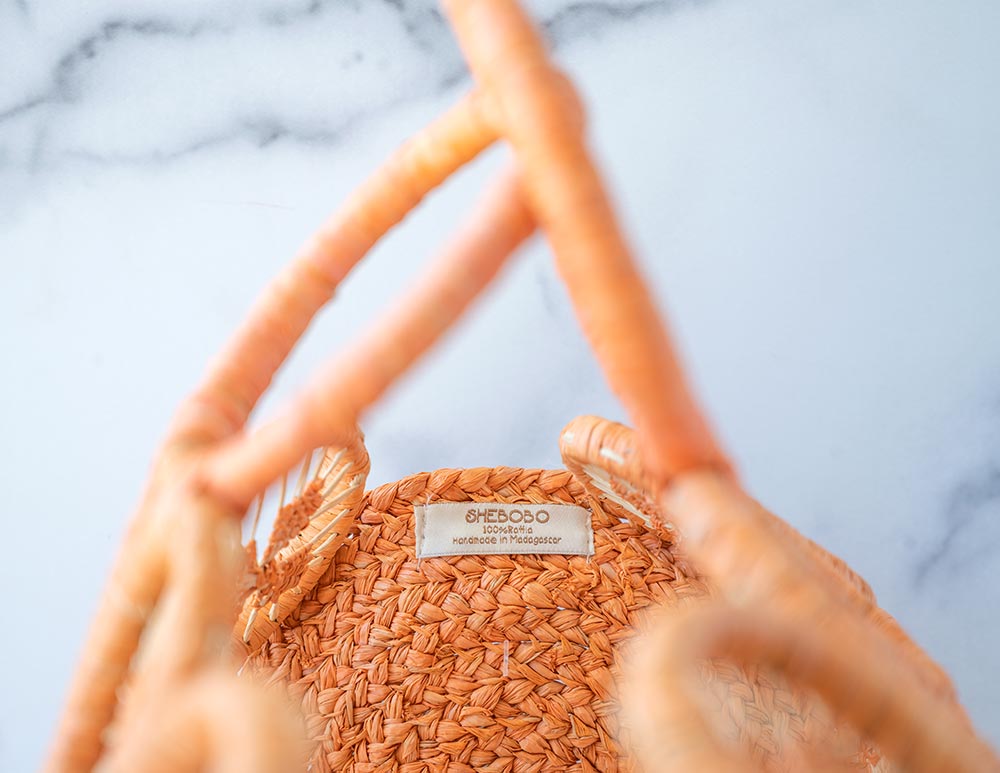 Closeup Interior View of the Shebobo Havana Macramé Straw Bag in Melon Sprinkles