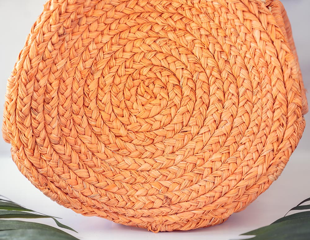 Closeup Side View of the Shebobo Havana Macramé Straw Bag in Melon Sprinkles