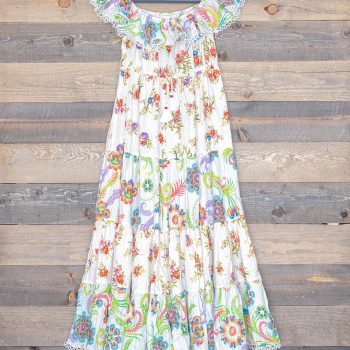 Front view of Ranee's White Cotton Lurex Floral Dress against a wooden backdrop