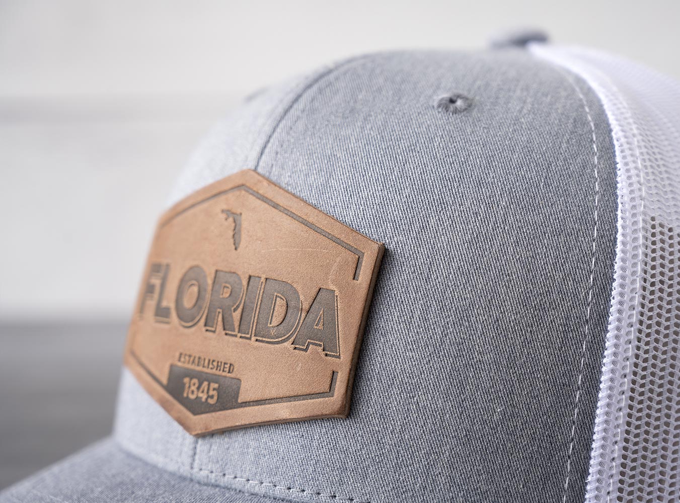 Closeup View of the RANGE Leather Florida Established Hat in Heather Gray & White
