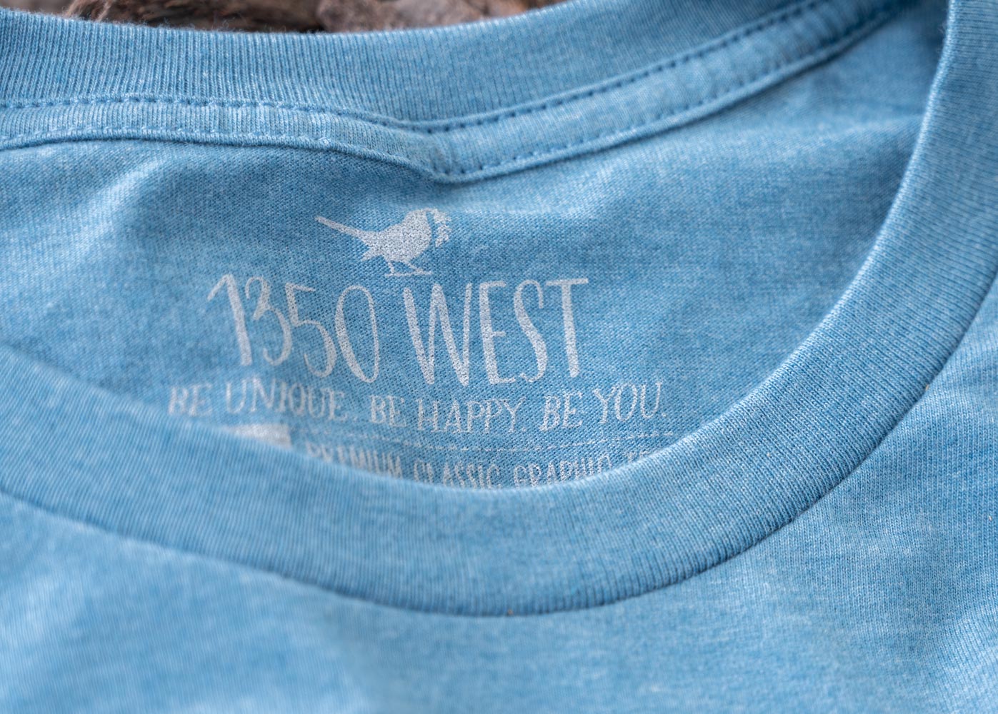 Closeup of the Collar and Inside Branded Tagging of The Salty. Sandy. Happy. Women’s Graphic Tee y 1350 West Southern Coastal Boutique & Gallery