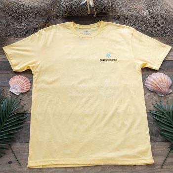 SImply Florida ISland Days tee resting against a rustic wood background and bnautcvial background accents of fishing net, sea shells and palm leaves