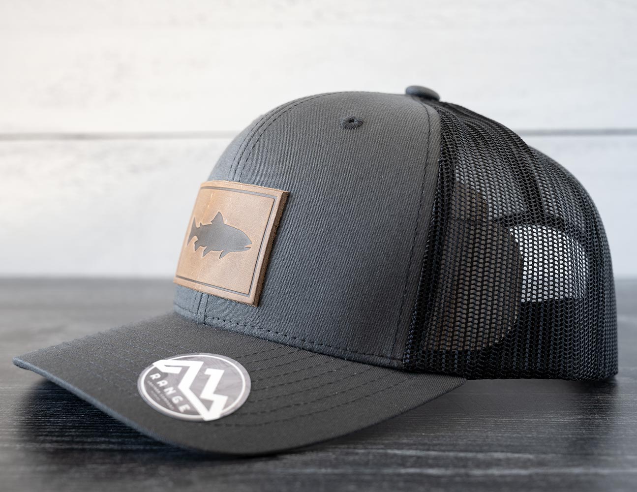 Right Angled View of the RANGE Leather Trout Hat in the Color Charcoal