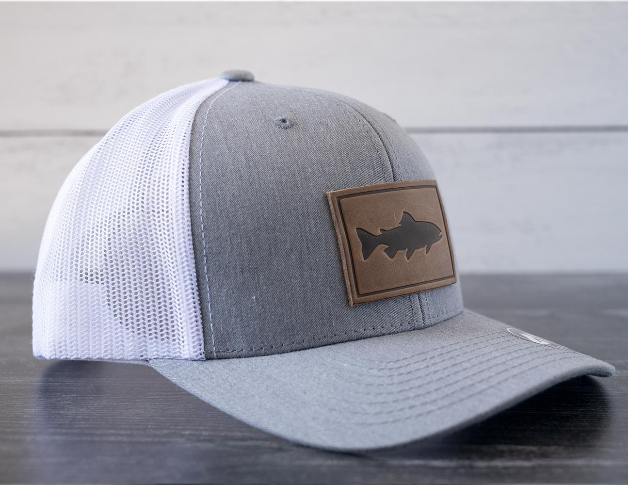 Left Angled View of the RANGE Leather Trout Hat in the Color Heather Gray & White