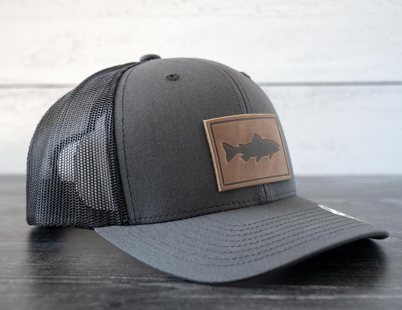 Left Angled View of the RANGE Leather Trout Hat in the Color Charcoal