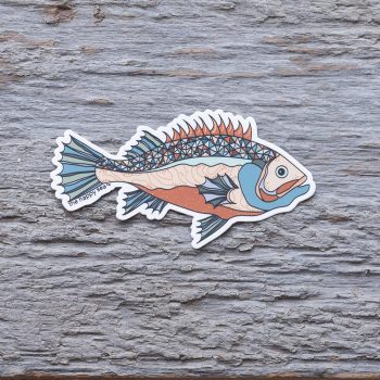 Top view of the Happy Sea Fish sticker on a rustic wood background