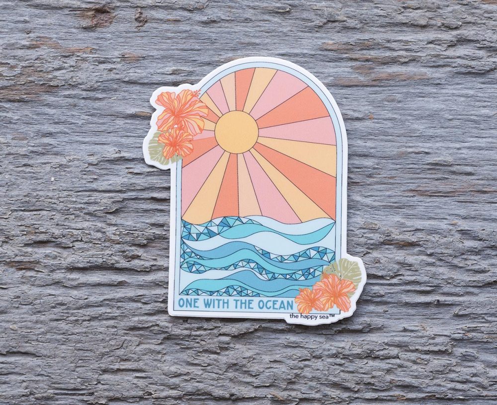 Top view of the Happy Sea One with the Ocean sticker on a rustic wood background