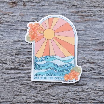 Top view of the Happy Sea One with the Ocean sticker on a rustic wood background